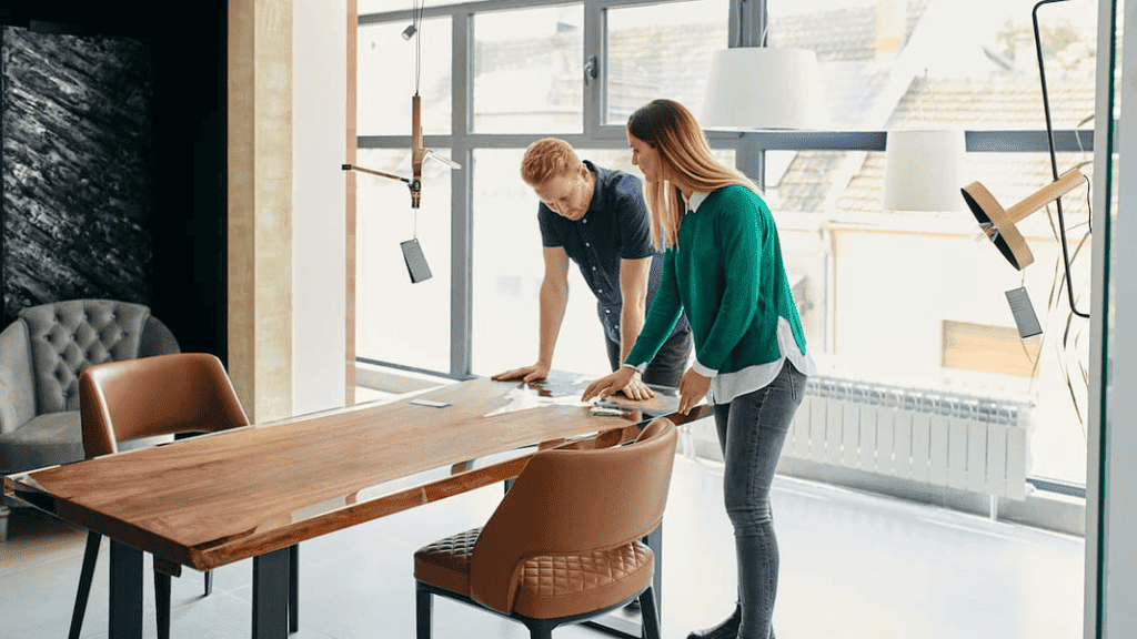 Two individuals collaborate on a task