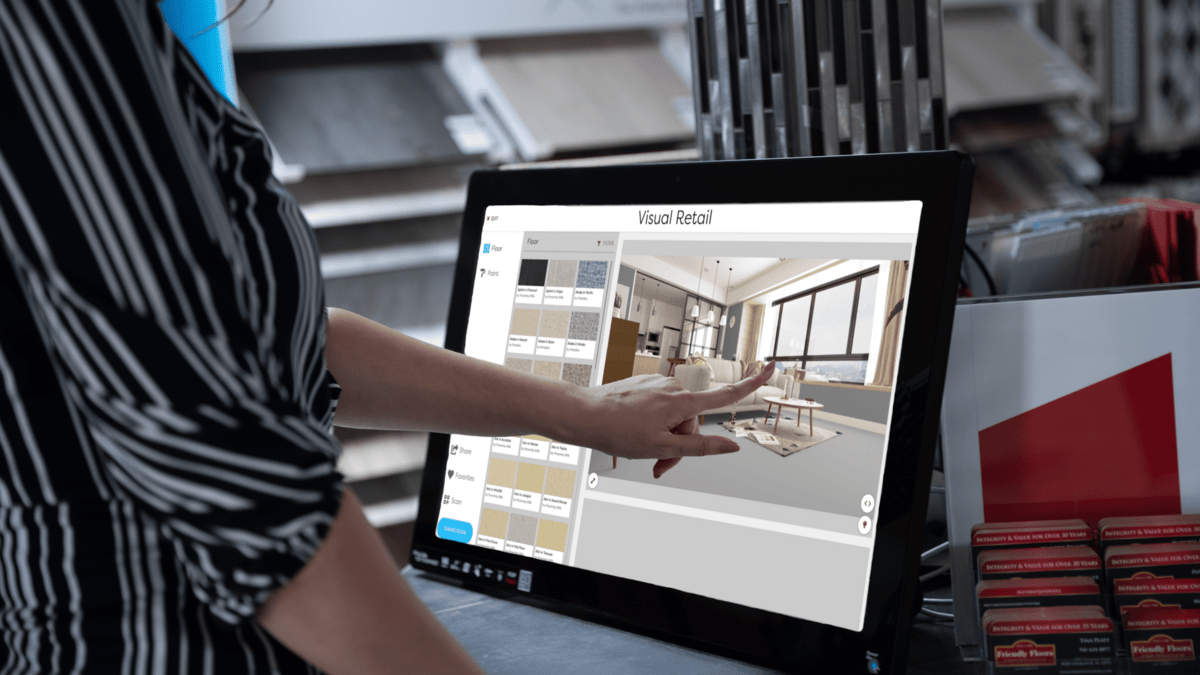 A woman choses a flooring design on the tablet